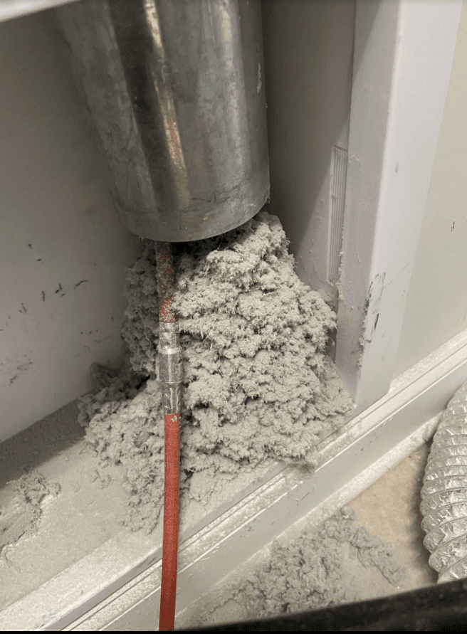 Professional dryer vent cleaning with brush in wall vent, Fresno CA