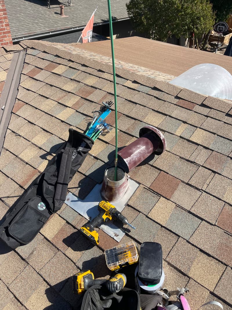 Commercial building exterior with ladder for vent access