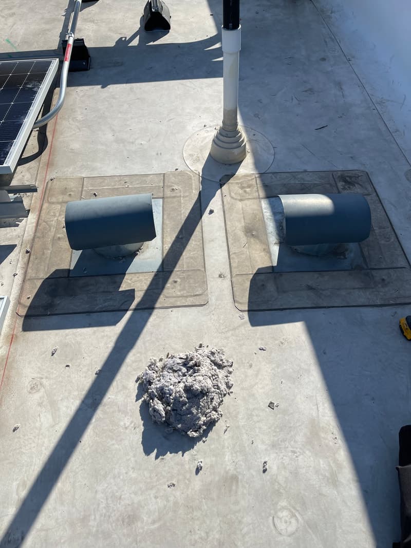 LintFree branded trailer and extension ladder at commercial site