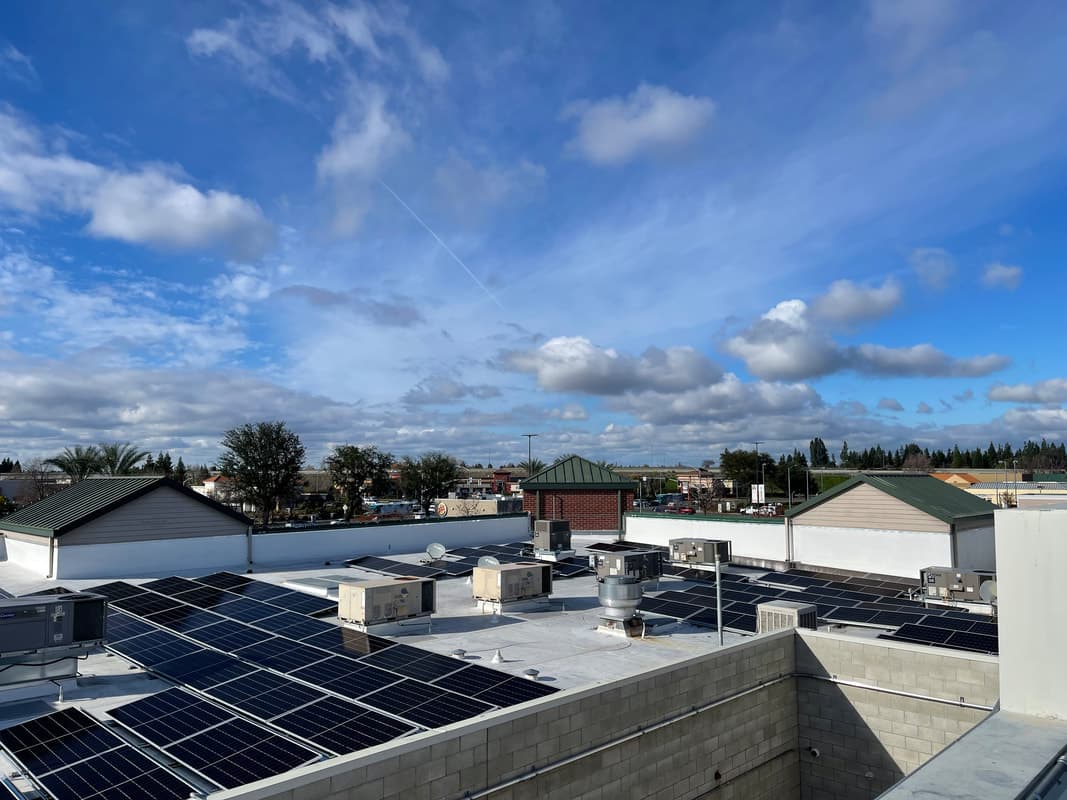 Professional dryer vent cleaning equipment and tools on flat roof